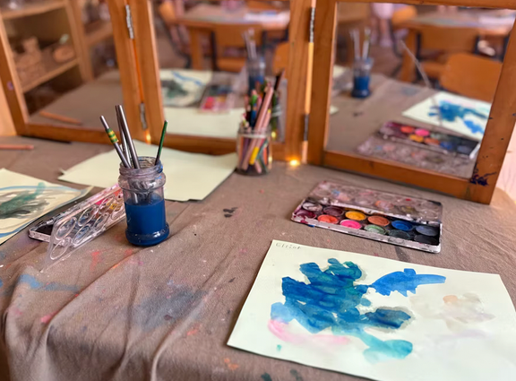 Watercolour paints and artwork at a Paint n’ Pray workshop